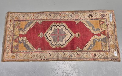 Lot 570 - An antique Turkish tribal rug, L 222 W 102cms
