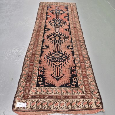 Lot 566 - An antique Persian tribal runner, L 318 W 110cms