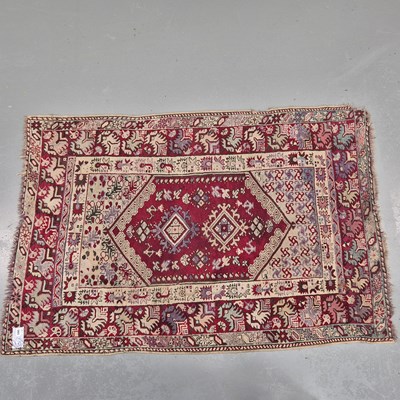 Lot 565 - An antique Turkish tribal rug, L 168 W 113cms