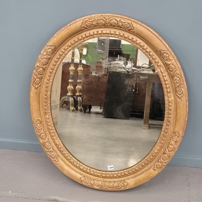 Lot 1209 - An early carved giltwood oval portrait frame...