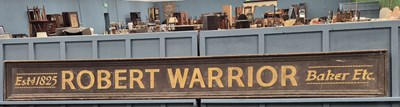 Lot 1517 - An antique hand-painted pine shop sign,...