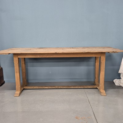 Lot 1518 - An antique pine and oak refectory table. L 200cms