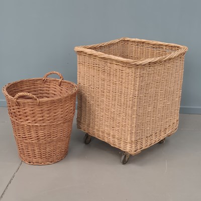 Lot 546 - A very large wicker basket/hamper on castors....