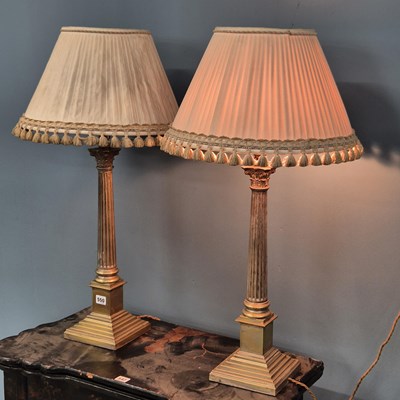 Lot 550 - A pair of vintage silvered brass Corinthian...