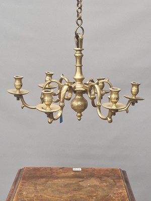 Lot 491 - An early brass six light Flemish style...