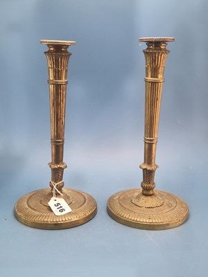 Lot 516 - A pair of French early 19th Century brass...