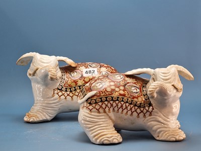 Lot 482 - A pair of antique Japanese pottery elephant...