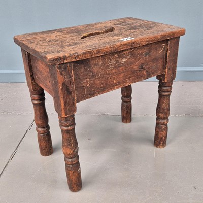 Lot 1268 - A rustic Elm topped stool.