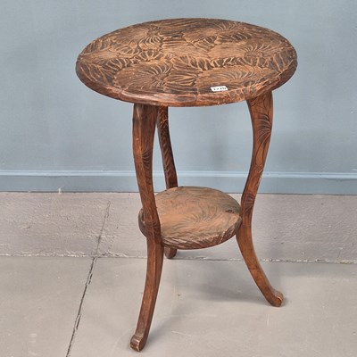 Lot 1270 - A Liberty Japanesque design carved circular...