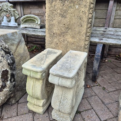 Lot 1106 - A composite stone bench on moulded block...