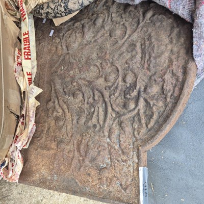 Lot 1110 - A large Georgian cast iron fire back with...