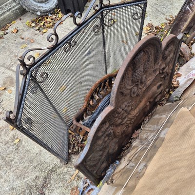 Lot 1111 - An antique style fire basket and fire back...
