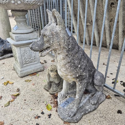 Lot 1114 - A composite stone figure of a seated alsation...