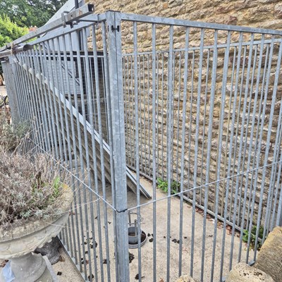 Lot 1115 - A galvanised dog run /cage with sheet steel roof
