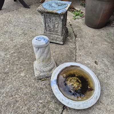 Lot 1117 - A brass sundial on plinth and a pedestal bird...