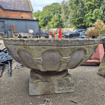 Lot 1118 - A large shallow garden urn on low plinth base