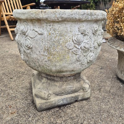 Lot 1121 - A garden urn with rose moulded decoration