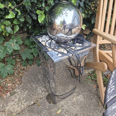 Lot 1126 - A modern polished chrome garden feature...