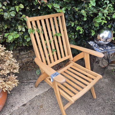 Lot 1128 - A pair of folding hardwood garden chairs.
