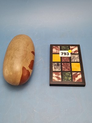 Lot 793 - A lingam stone.   W 15cms. together with...