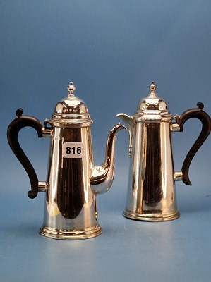 Lot 816 - A George III style silver coffee pot and a hot...