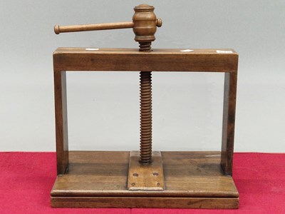Lot 829 - A 19th century mahogany book press, the plate....