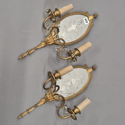 Lot 832 - A pair of early 20th century ormolu girandoles,...