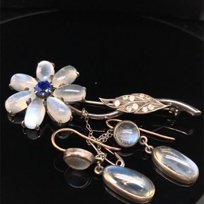 Lot 1222 - A vintage moonstone and gemset floral brooch...