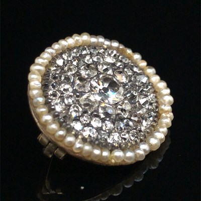 Lot 1223 - An antique old cut diamond and pearl brooch,...