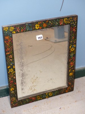 Lot 753 - A small wall mirror with floral hand-painted...