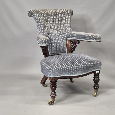 Lot 1040 - A Victorian library armchair with turned...