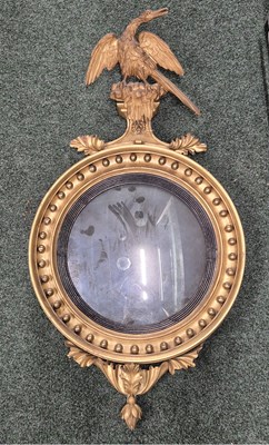Lot 1047 - A Regency Large convex wall mirror with ball...
