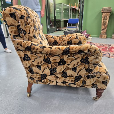 Lot 1277 - A Howard style armchair on mahogany legs with...