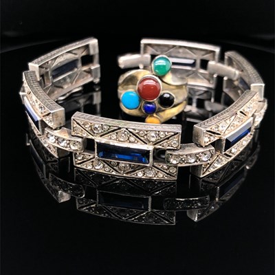 Lot 1060 - An Art Deco silver and stone set panel...
