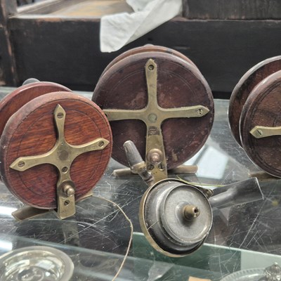 Lot 1071 - Three mahogany and brass star back fishing...