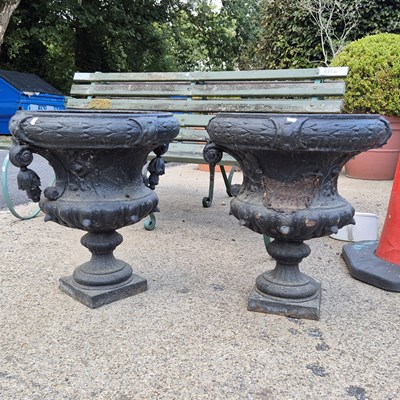 Lot 1138 - A Pair of antique cast iron garden urns.