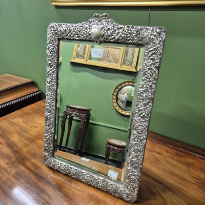 Lot 1704A - An easel backed rectangular mirror in a silver...
