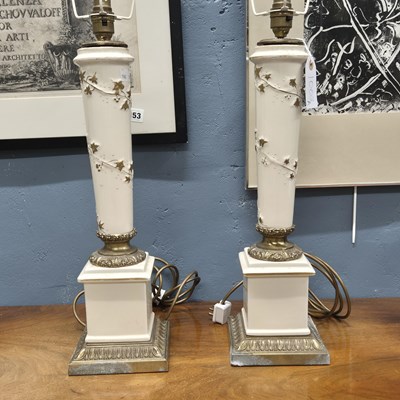 Lot 1003A - A pair of gilt metal mounted white ceramic...