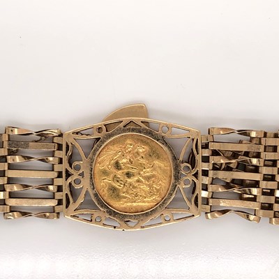 Lot 1236B - A 1914 full sovereign coin held in a 9ct gold...