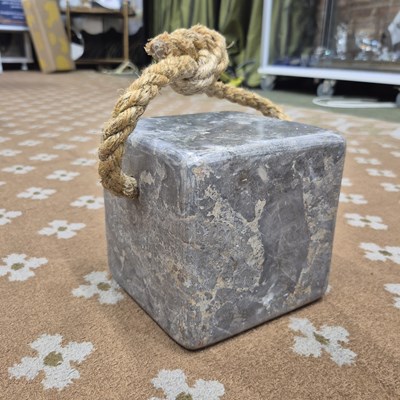 Lot 260 - A substantial stone door stop of square form,...