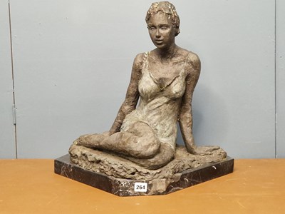Lot 264 - A 20th century bronze of a seated lady, her...