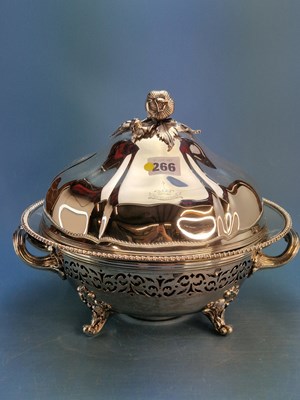 Lot 266 - A set of four crested silver covered tureens...