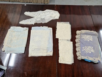 Lot 297 - A box of lace: squares, collars, fragments of...