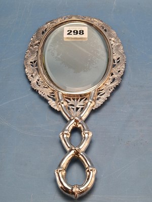 Lot 298 - A Chinese white metal double sided hand mirror...