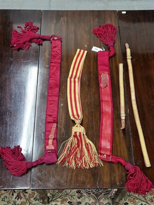 Lot 304 - Two officer's red waist sashes, another in red...