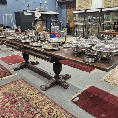 Lot 311 - An oak refectory table extending at each...