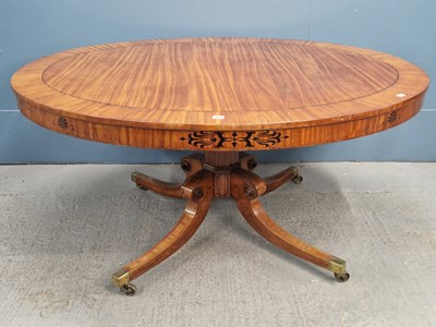 Lot 313 - A 19th century cross banded satinwood centre...