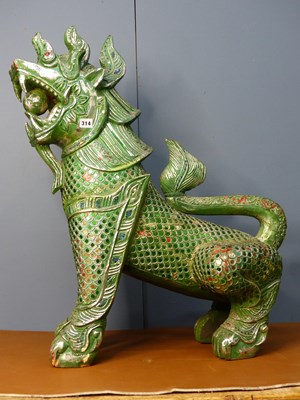 Lot 314 - A green composition figure of a qilin seated...