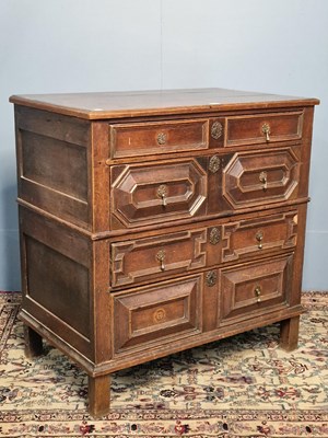 Lot 322 - An 18th century oak chest of four long drawers...