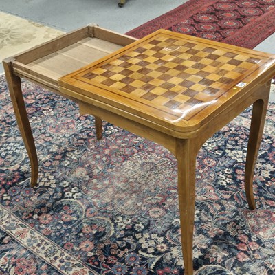 Lot 328 - A French provincial inlaid walnut games table,...